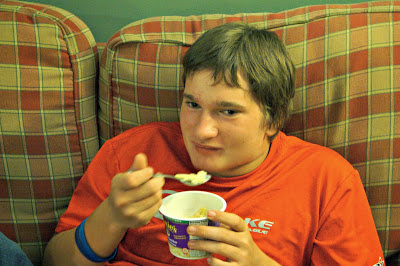 The teenager enjoying his Annie's Homemade Mac and Cheese